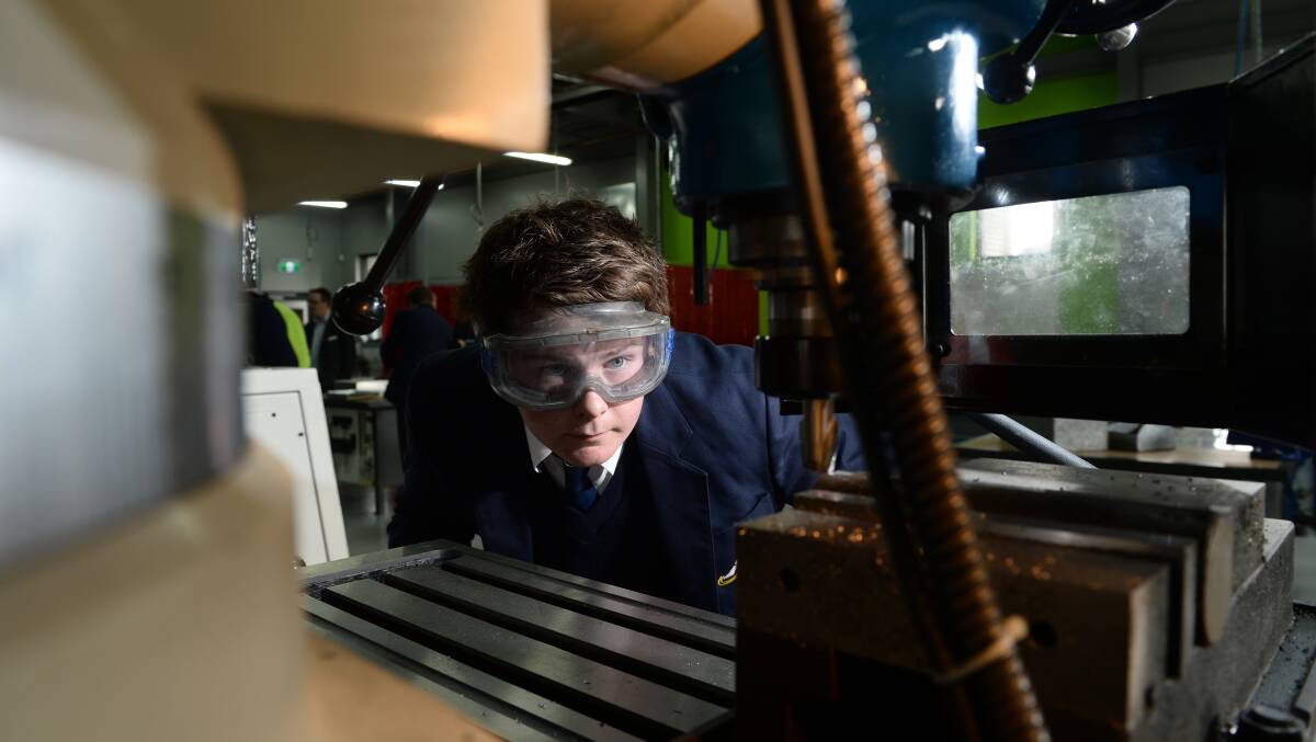 Student Jayden Asplan,15, uses a milling machine in the new trade training centre. Picture: ADAM TRAFFORD 