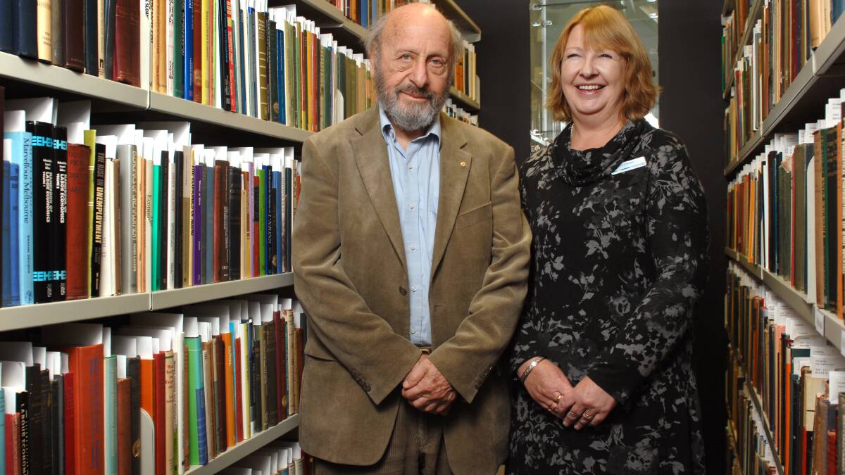 The Creedy Collection of rare and valuable books about economics has been donated to Fed Uni. Admiring them are Professor Emeritus Geoff Harcourtand  FedUni library services director Leeanne Pitman. PICTURE: ADAM TRAFFORD