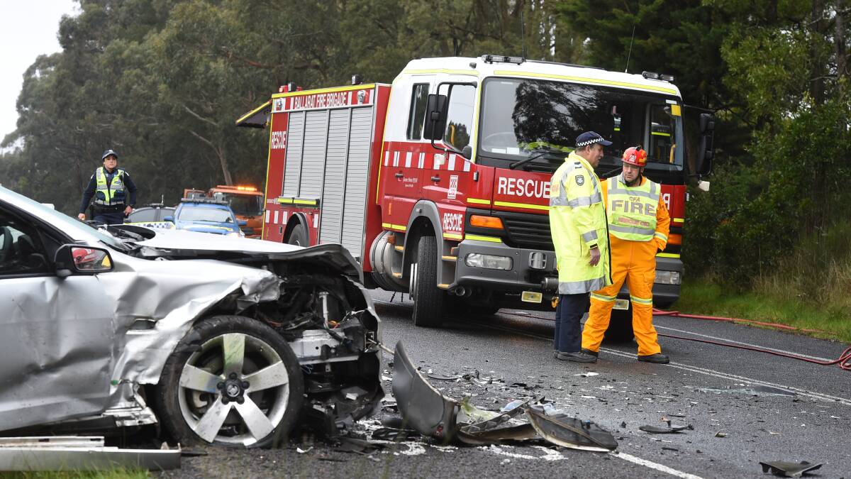 Police and firefighters attend the scene of a four-car pile-up in Eureka Street on Thursday which kept the road blocked for two-and-a-half hours. PICTURE: LACHLAN BENCE