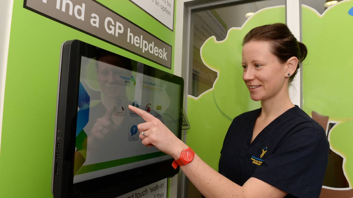 Waiting room nurse Debra Curran tries out Ballarat Health Services’ new Find a GP helpdesk. PICTURE: KATE HEALY