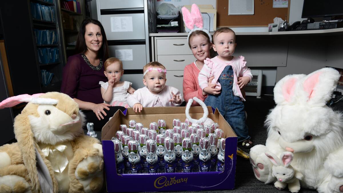 With some of the donated eggs to help struggling families have a happy Easter are, from left, People@Work recruitment executive Tarryn Connor, Lilly Connor, 1, Georgia Smith, 1, Ruby Lloyd-Vendy, 11, and Adalynn Moore, 1. PICTURE: ADAM TRAFFORD