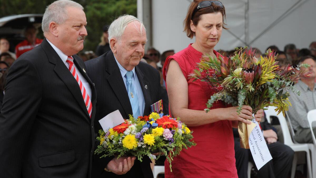 Bill Bahr, Les Kennedy and Jeanette Neville during a service at the Australian Ex-Prisoners of War Memorial in 2012. PICTURE: JEREMY BANNISTER 
