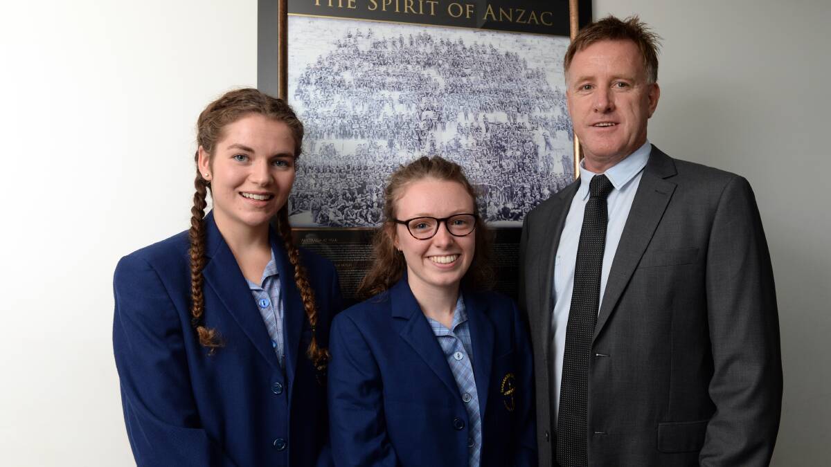 Damascus College students Brooke Hutchinson and Giarn Carroll will travel to Canberra for the Anzac centenary, while teacher Brendan Bawden will travel to Europe. PICTURE: KATE HEALY
