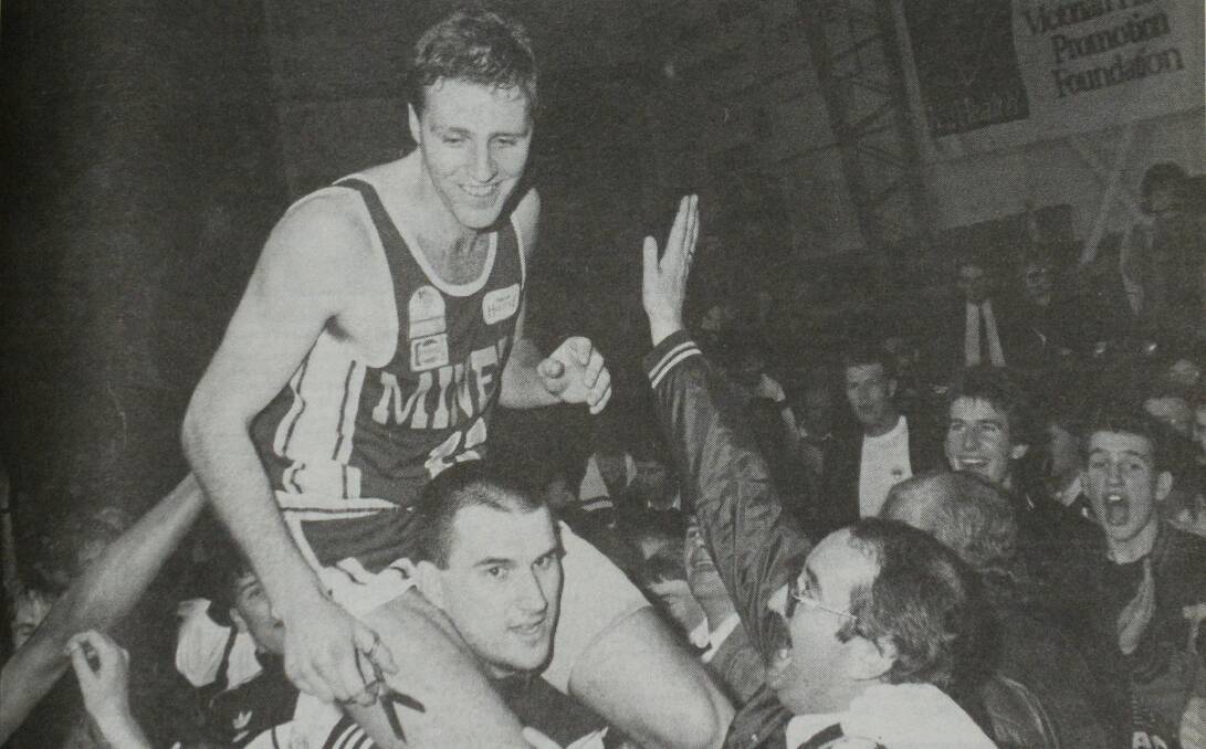 Ballarat Miners captain Glenn White is chaired to cut down the net after the epic win. Photo: The Courier, 1989