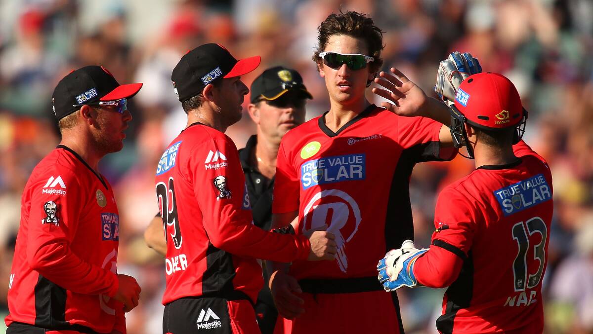 Ballarat's Matt Short celebrates with teammates after capturing his first wicket on debut for Melbourne Renegades in BBL. Photo: Getty Images.