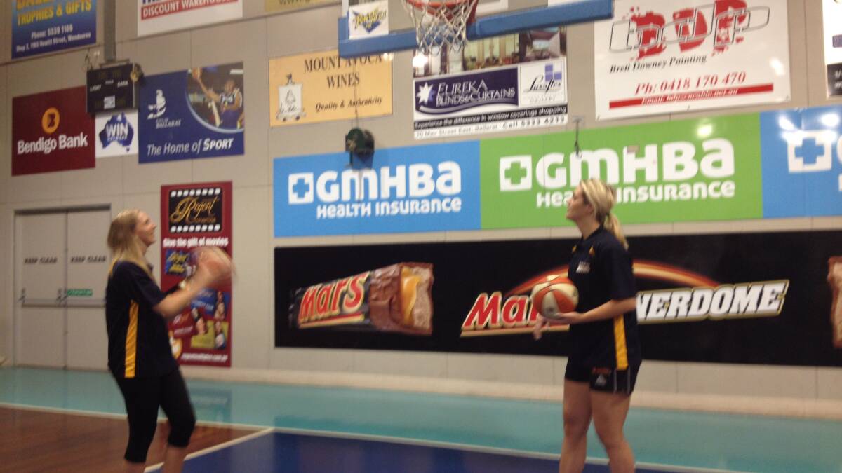 WNBL duo Jess May and Shanae Greaves test out their new home court at the Minerdome on Friday morning.