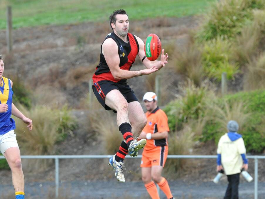 Buninyong forward Phil Benn jumps for a mark on Saturday. Picture - Lachlan Bence.