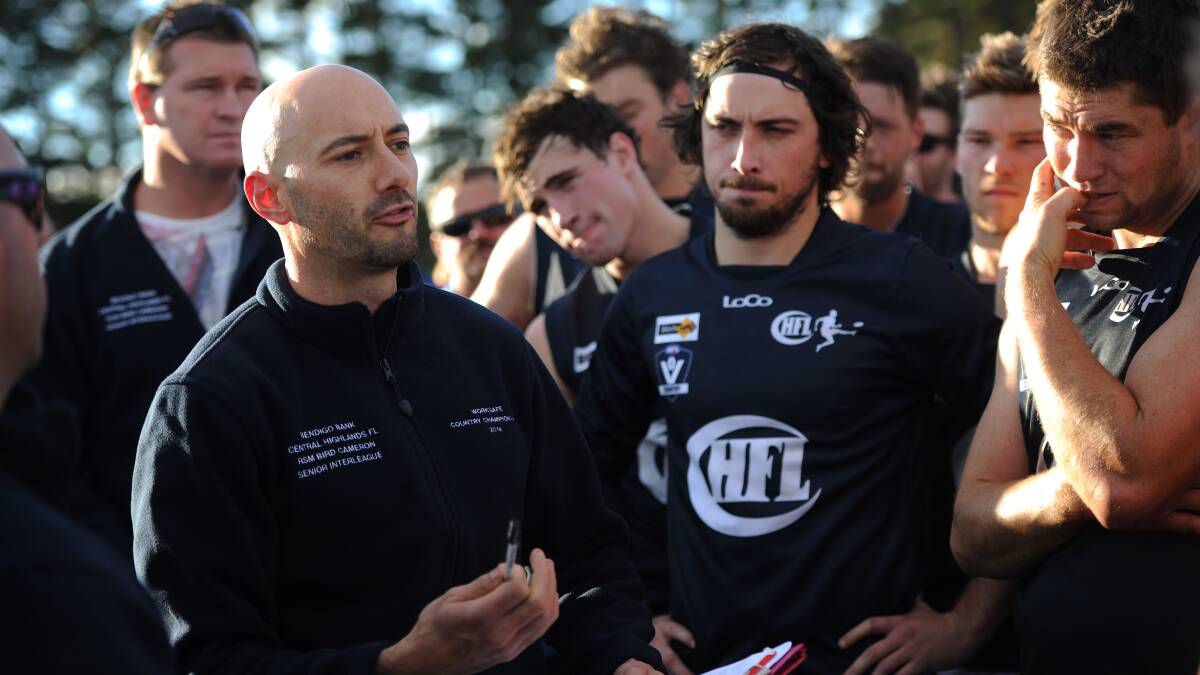 Central Highlands coach Greg Middleton speaks to his charges last year.