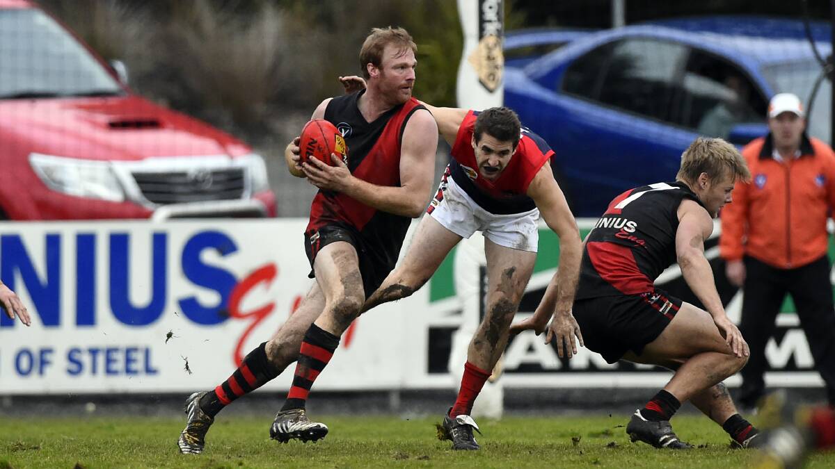 Buninyong defender Mark Phelps breaks clear in the Bombers' seven-point win over Bungaree on Saturday. Picture - Justin Whitelock.