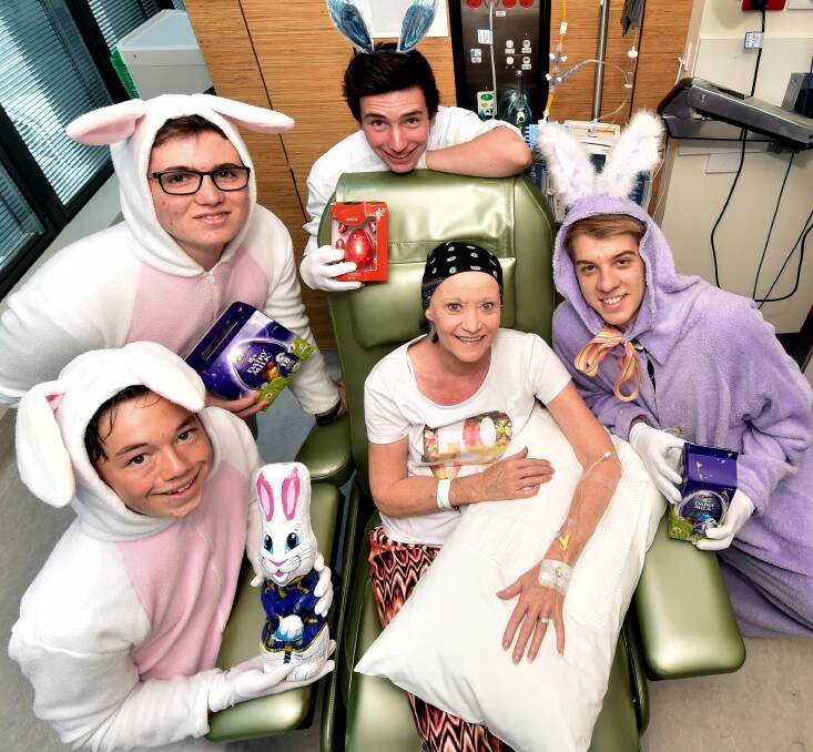 St Patrick’s College students Brayden Ward, Alec Robinson, James Parini and Kelsey Gannon deliver Easter eggs to Kerren Goodwin. PICTURE: JEREMY BANNISTER