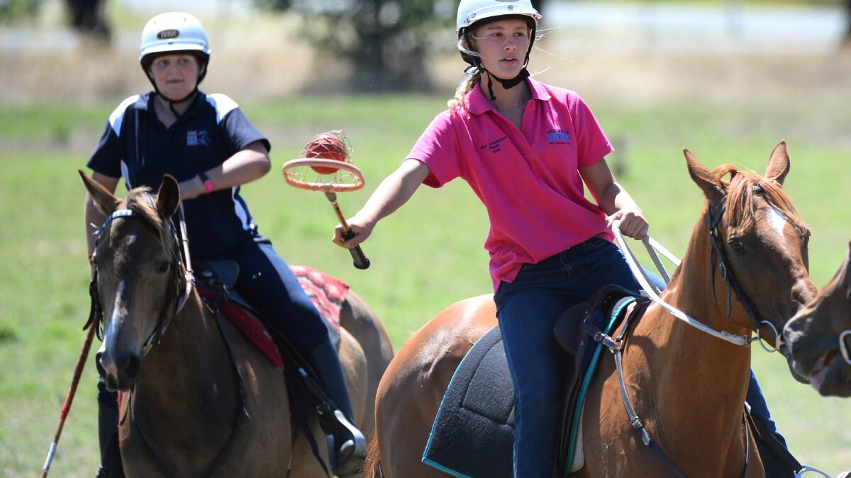 Haydan Poltorasky and Isabelle Greenhill go through their paces at the Ballarat Polocrosse Grounds training camp. PICTURE: ADAM TRAFFORD