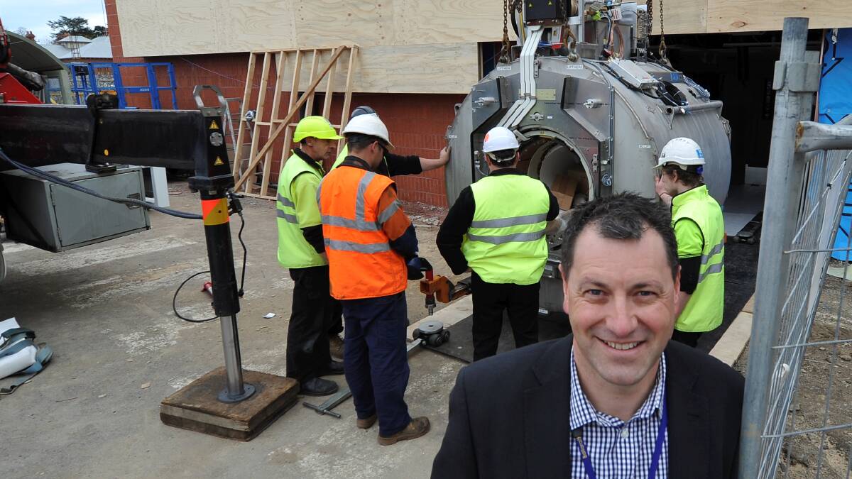 Ballarat Health Services Base Hospital’s new MRI machine is installed on Friday with deputy director of radiology Craig Wilding on hand to see the proceedings. 