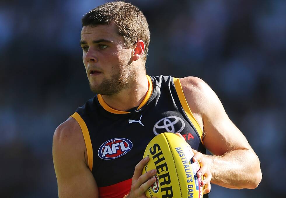 Adelaide Crows player Brad Crouch has a broken leg after a clash with Port Adelaide's Brad Ebert.
