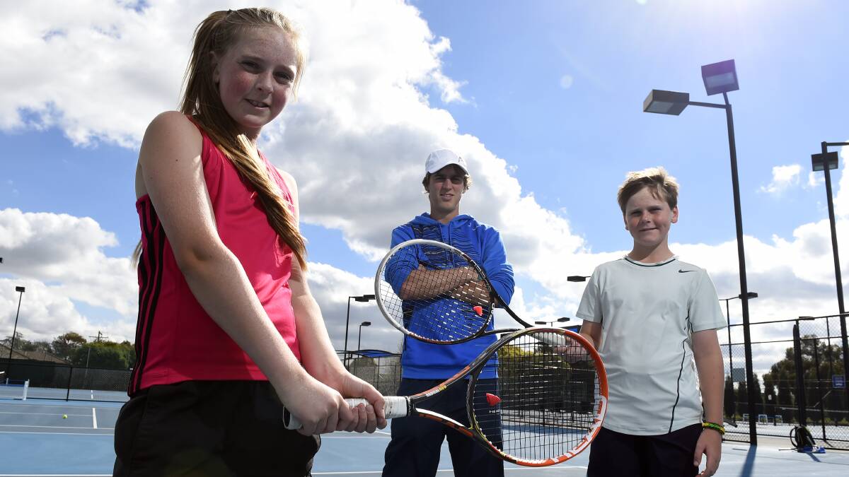 Emily tinker, 12, organiser Jake Dunn and Hugh McManus, 11, are ready for the Ballarat Regional Junior Tennis Championship.
