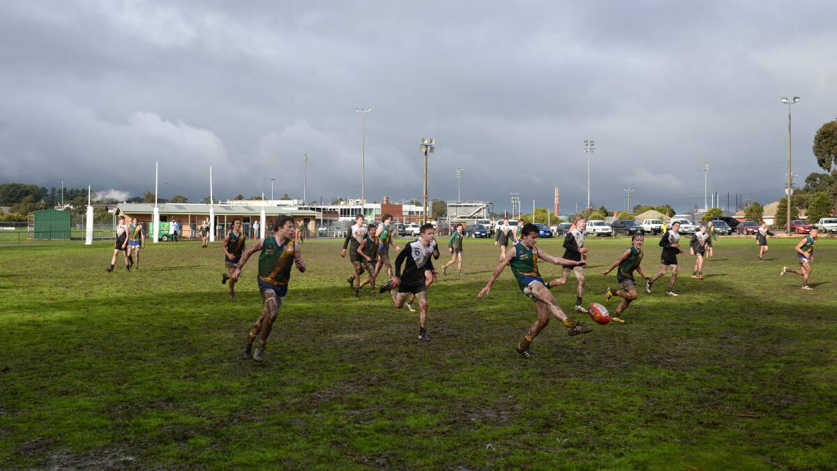 Lake Wendouree footballers play on a muddy oval. Under-16.5 reserves junior match Lake Wendouree Vs North Ballarat. 