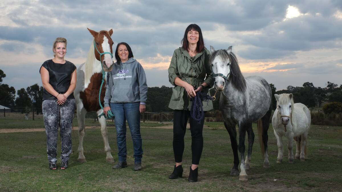 Supporting the Survivors of Suicide program are, from left, Larelle Kuczer from Youth Engagement – Headspace, Survivors of Suicide founder Kristy Steenhuis and Lifeline Ballarat manager Kellie Dunn. Horses Annie and Rebel are an integral part of the program. 