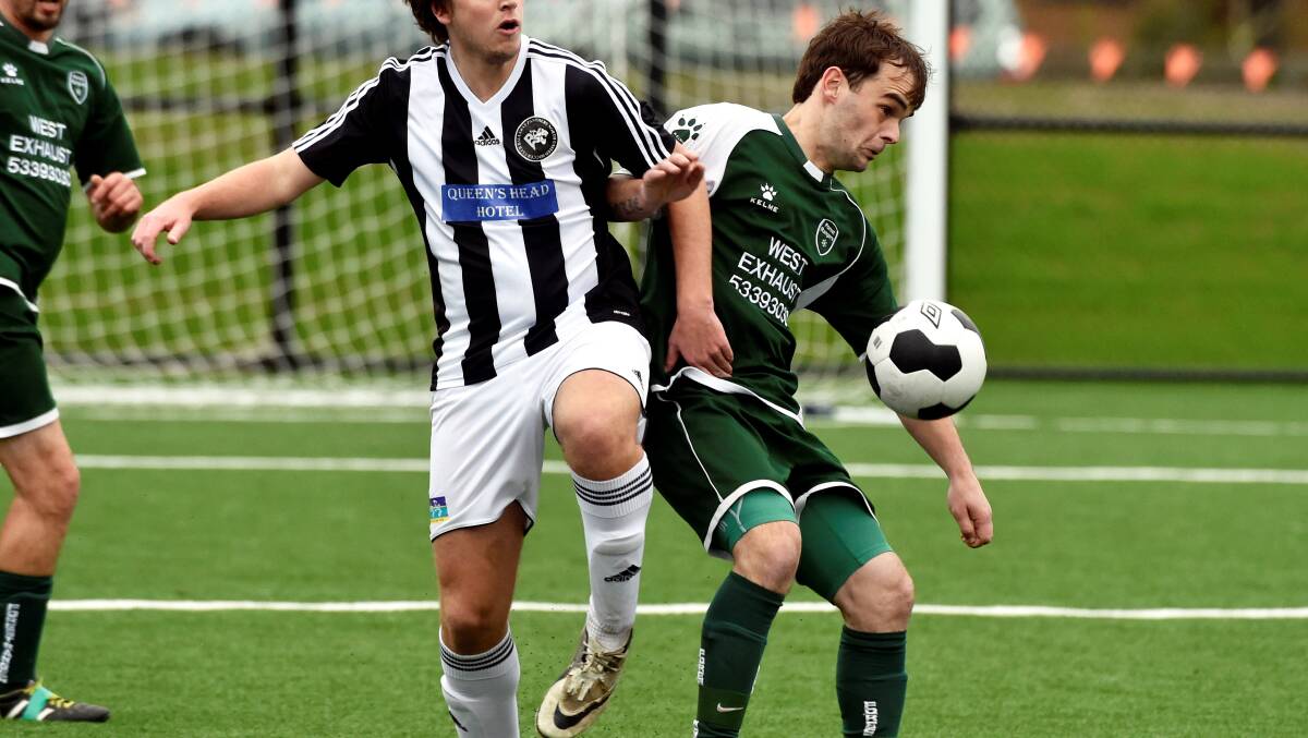 Dean Banner (North United) and Forest Rangers’ Daniel Cook lock horns in their BDSA divison one match at Morshead Park.