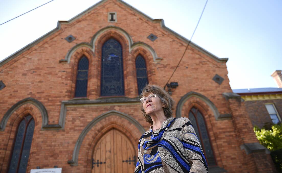 Ballarat historian Dr Anne Beggs-Sunter is worried the Barkly Street Uniting Church’s rare World War I stained-glass windows could be endangered if the building is sold. PICTURE: JUSTIN WHITELOCK