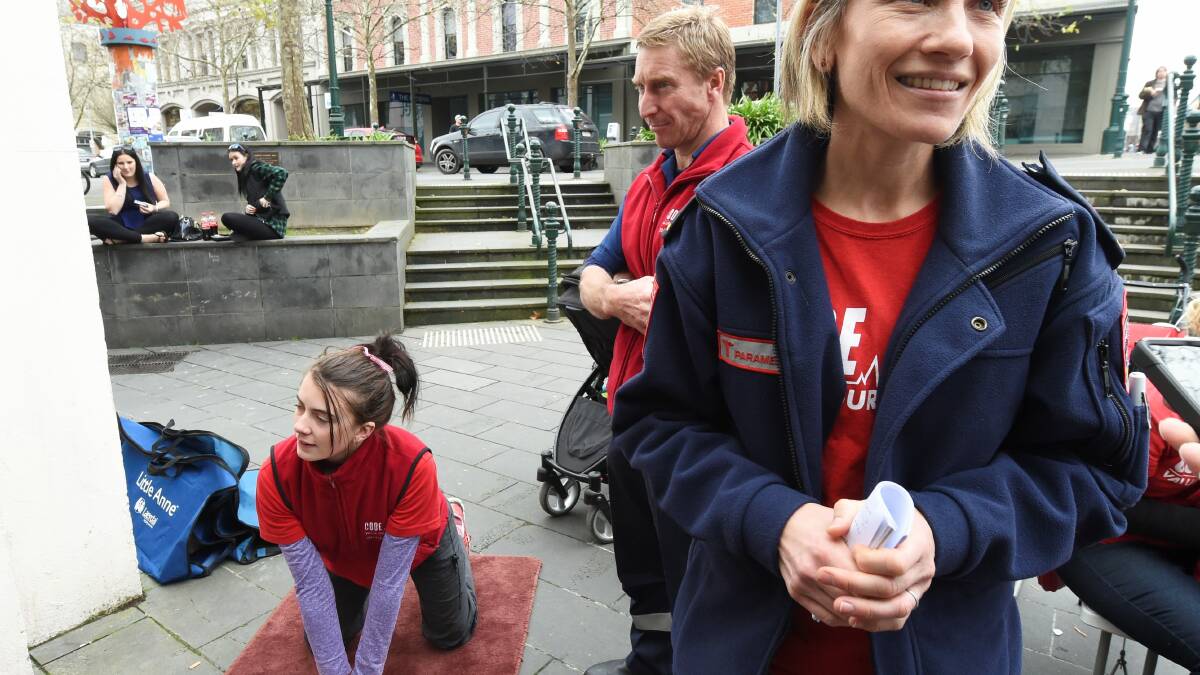 Paramedic Sarah Brennan provides free CPR lessons at Central Square. 