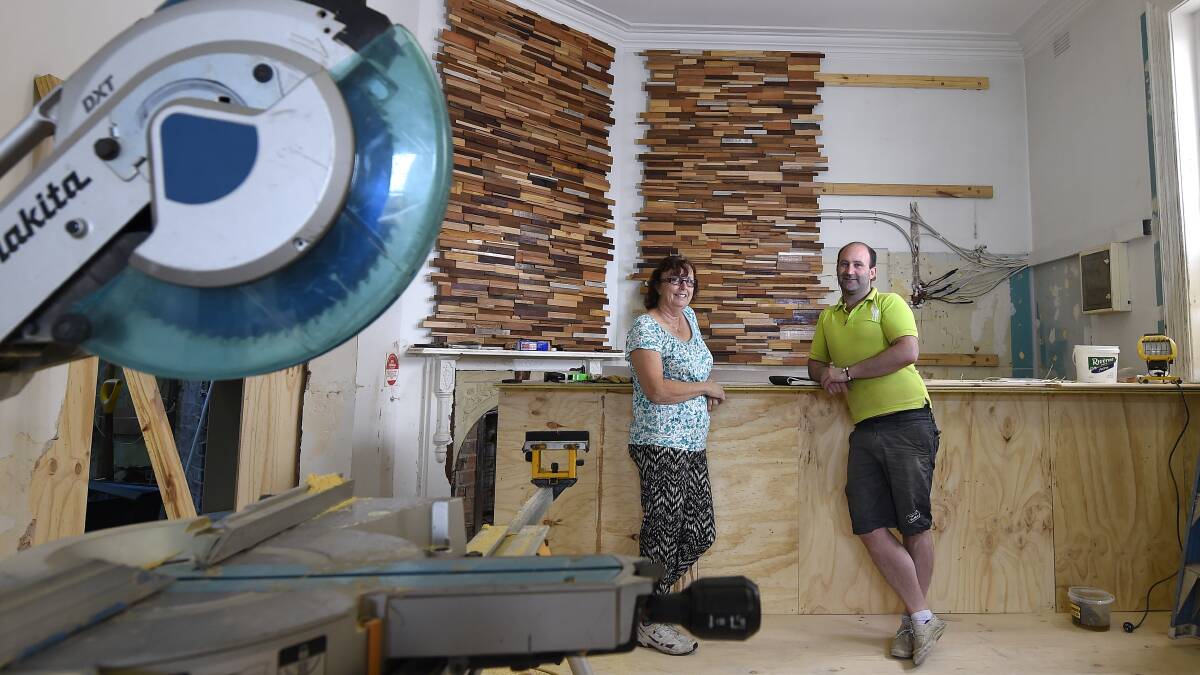 Cook Julie Eaton and business owner Chris Gusman amid the renovations to the Drummond Street cafe, which will have the flavour of a 1920s wine and tapas bar. PICTURE: JUSTIN WHITELOCK