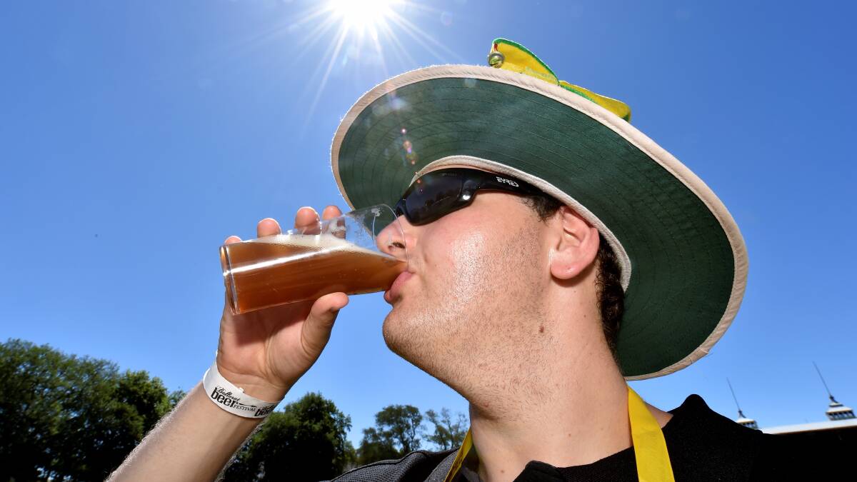 Jesse Sharp enjoys a cool beer on the hot day. PICTURE: JEREMY BANNISTER