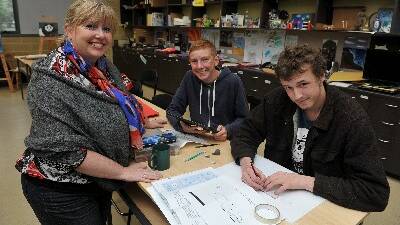 Ballarat Christian College visual communication and design teacher Carol Clough, with year 9 student Liam Clough and year 12 student Xavier Hourigan.