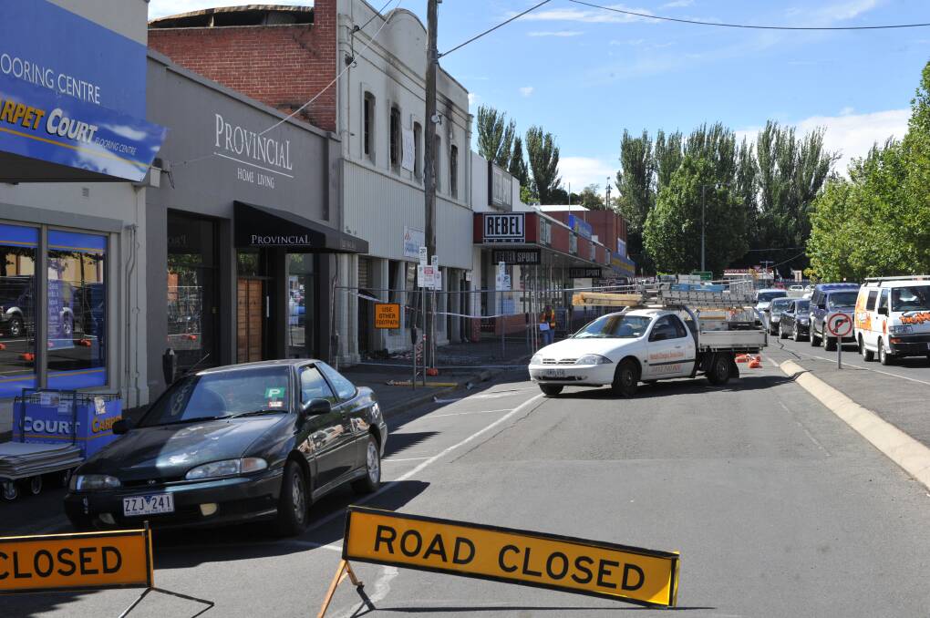FILE PIC: Grenville Street is closed to traffic after a fire at the Plaster Fun House last month.