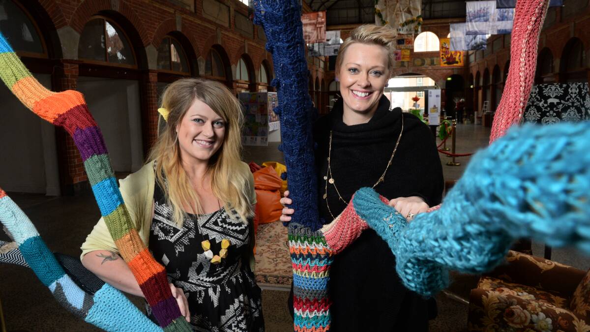 A bit of fun: Rachel Jackson and Tas Wansbrough with a yarn-bombed tree of their own creation.
