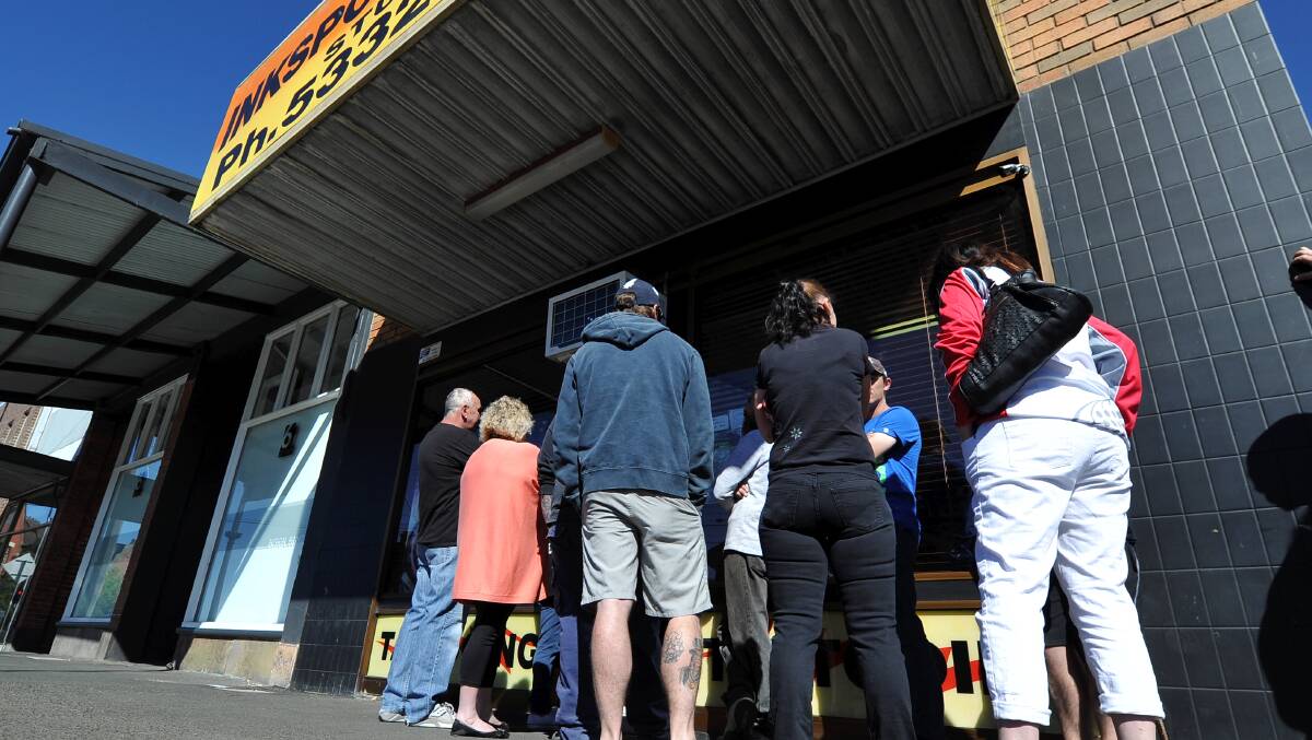 Loyal customers to Inkspot Tattoo Studio queue for days for an appointment. PICTURE: Lachlan Bence