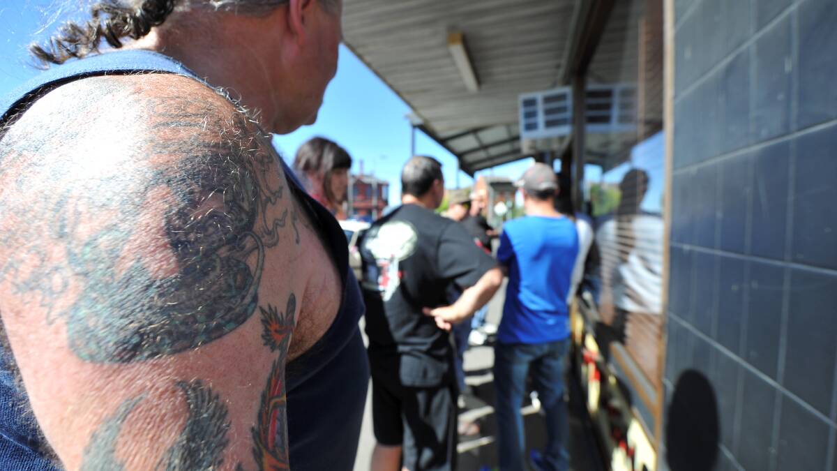 Loyal customer Ronnie waits for Inkspot Tattoo Studio appointment. PICTURE: Lachlan Bence