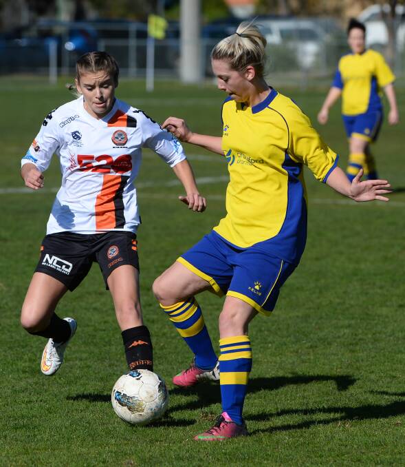 Viking Kassandra Stabb (left), fighting for possession against Truganina’s Kayla Stavreski, impressed in her first start on the pitch on Sunday.