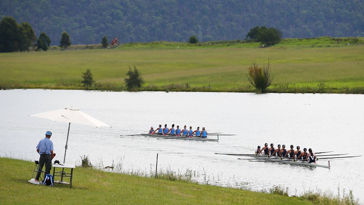 The NSW and Victorian Womens crews row to the start of the Interstate womens eight race during the Rowing World Cup. Photo: Getty