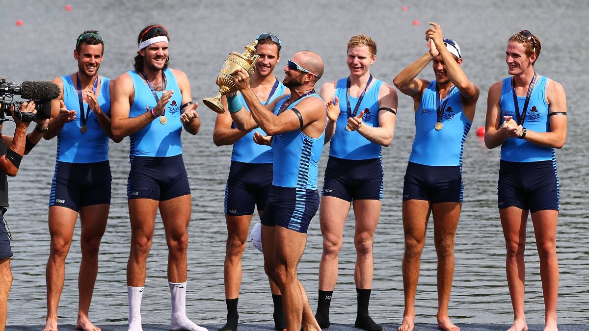 James Chapman holds aloft the Kings Cup after NSW won the Interstate Mens Eight race during the Rowing World Cup. Photo: Getty