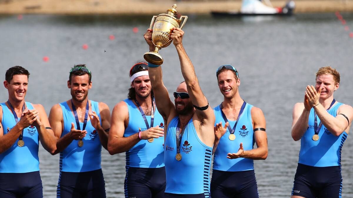James Chapman holds aloft the Kings Cup after NSW won the Interstate Mens Eight race during the Rowing World Cup at the Sydney International Rowing Centre . Photo: Getty