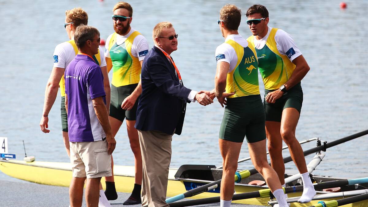John Coates of the AOC shakes hands with the victorious Australian Mens Four crew during the Rowing World Cup at the Sydney International Rowing Centre on March 30. Photo: Getty