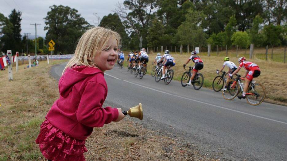 Fans are enjoying the better than expected weather as the women race down from the Buninyong climb.  Picture: Cycling Australia