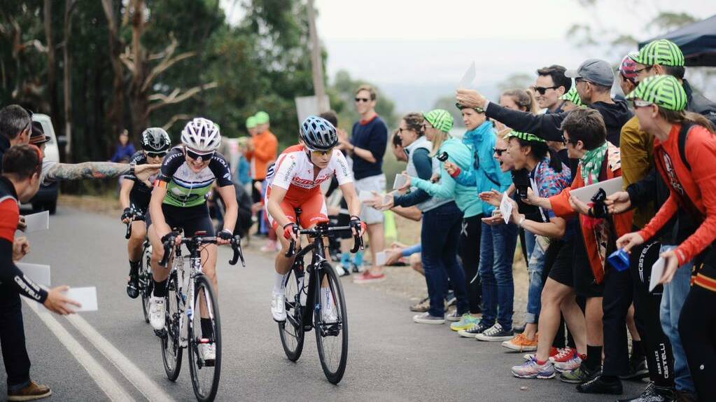 The crowd cheer on the leading riders at Buninyong. PICTURE Girl climb 