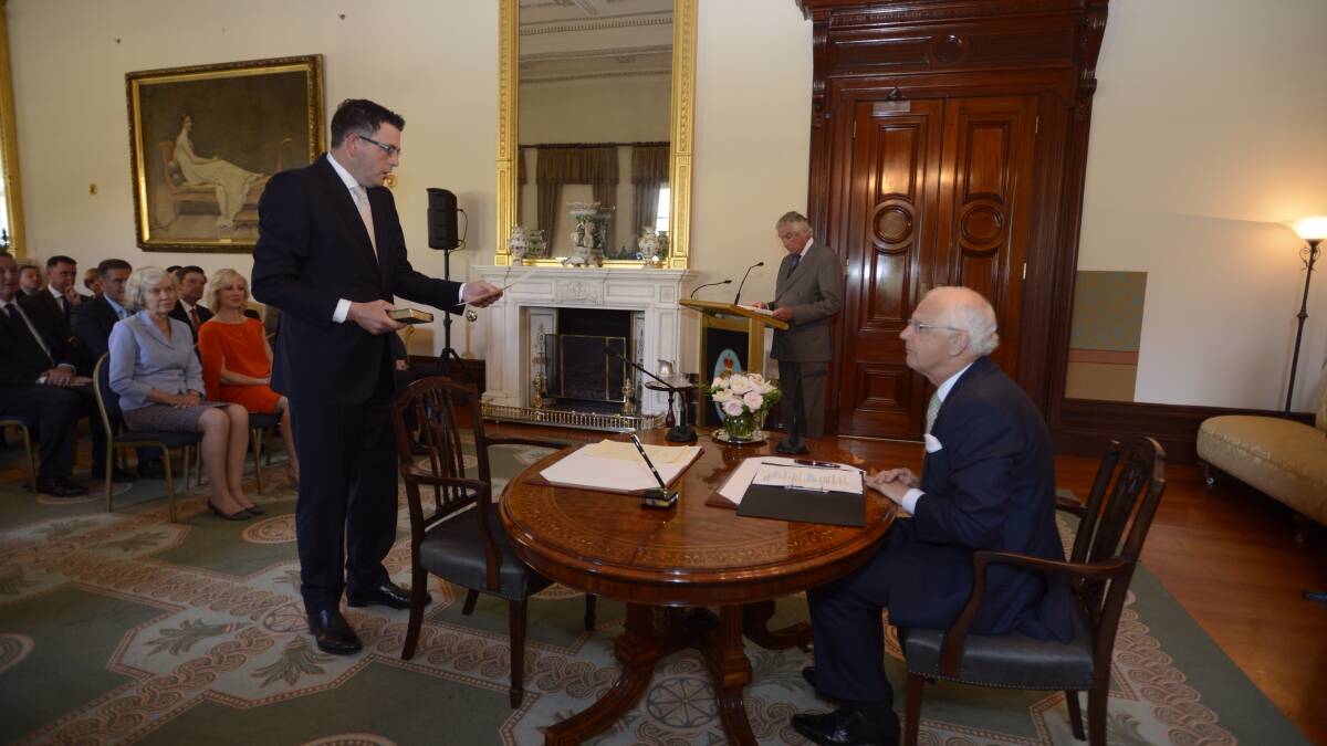 The new Premier Daniel Andrrews takes the oath. PICTURE: THE AGE
