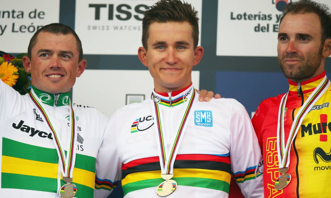 Polish rider Michel Kwiatowski in the rainbow jersey with Simon Gerrans in second and Spains Alejandro Valverde in third