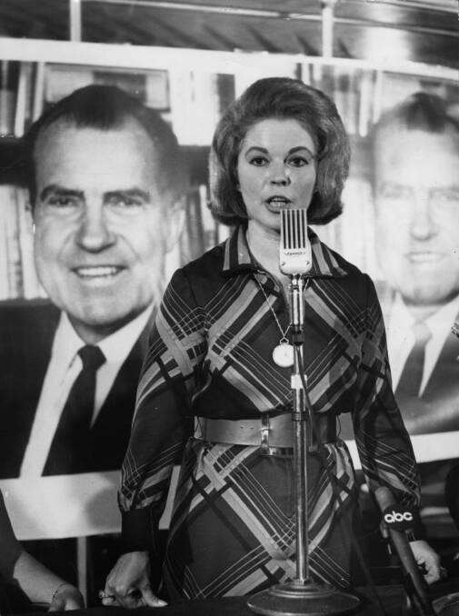 Shirley Temple speaks in front of a poster of Richard Nixon at a Republican Party election press conference at the Cafe Royal in London in September 1968. Picture: Getty Images