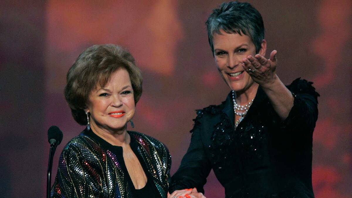 Shirley Temple accepts the Life Achievement Award from presenter Jamie Lee Curtis onstage during the 12th Annual Screen Actors Guild Awards in 2006. Picture: Getty Images