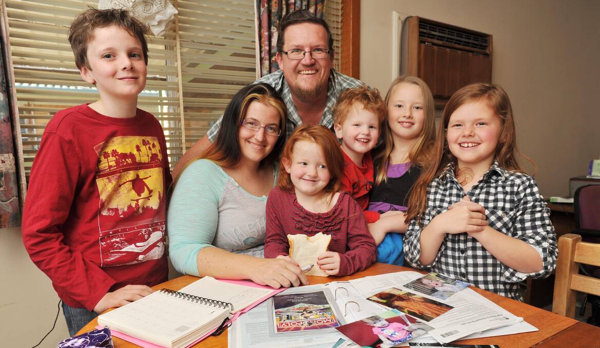 Theo Burton (left), Rebbecca Fullwood, Elaina Fullwood, Thomas Burton, Christopher Fullwood, Jenniffer Fullwood and Emmilly Fullwood were remaining hopeful they'd find a new rental property to call home when they spoke to The Daily Advertiser earlier this month. About two weeks ago they found one on the outskirts of Tarcutta, where they only pay $200 a week rent. Picture: Kieren L Tilly