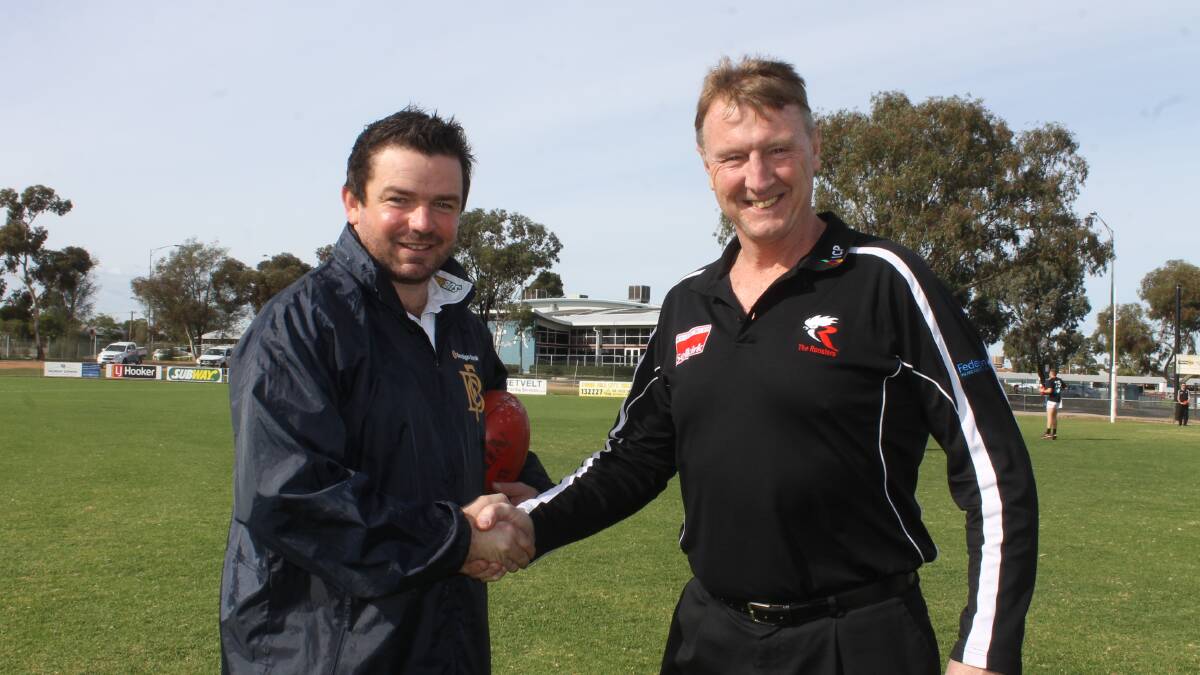 Bendigo Gold coach Aussie Jones and North Ballarat Roosters coach Gerard FitzGerald shake hands before the VFL game played on the road in Swan Hill. The game, played at Tyntynder’s home ground, was to promote the league in northern Victoria. FitzGerald said the game drew a good, solid crowd, and that Tyntynder had gone to great effort to ensure the ground was in great condition. PICTURE: Andrew Rogers, The Guardian