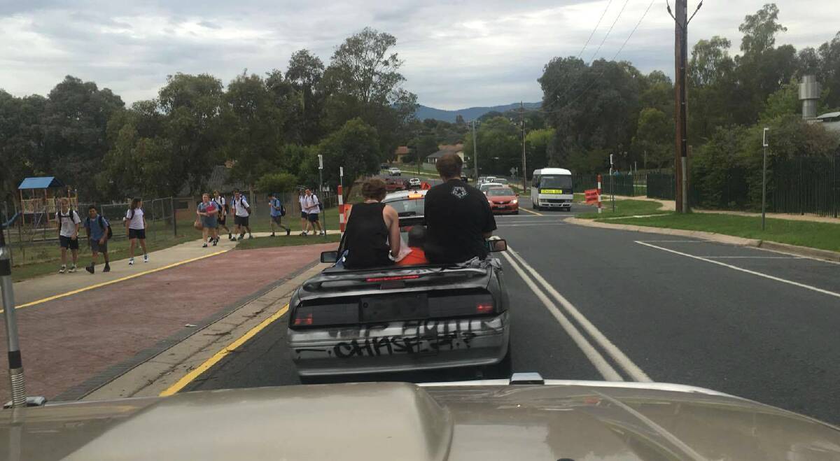 DANGEROUS: Police have slammed the actions of those responsible for this driving, who are pictured travelling through a school zone.