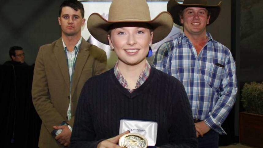 Jake Taylor and Josh McRae watch on as Natalie Grylls recieves the Matthew George Young Stockman Award at the Royal Melbourne Show.
