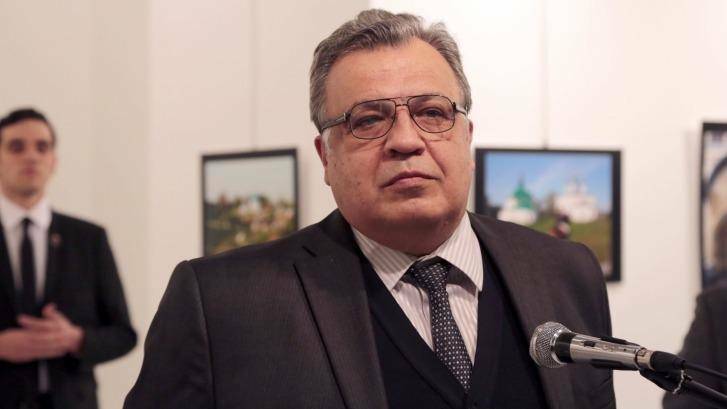 Russian Ambassador to Turkey Andrei Karlov makes an address at the gallery moments before he is shot by Mevlut Mert Altintas, who is seen over his shoulder. Photo: Burhan Ozbilici/AP