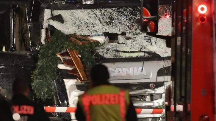Police stand in front of a black lorry that ploughed through a Christmas market in Berlin. Photo: Sean Gallup/Getty Images