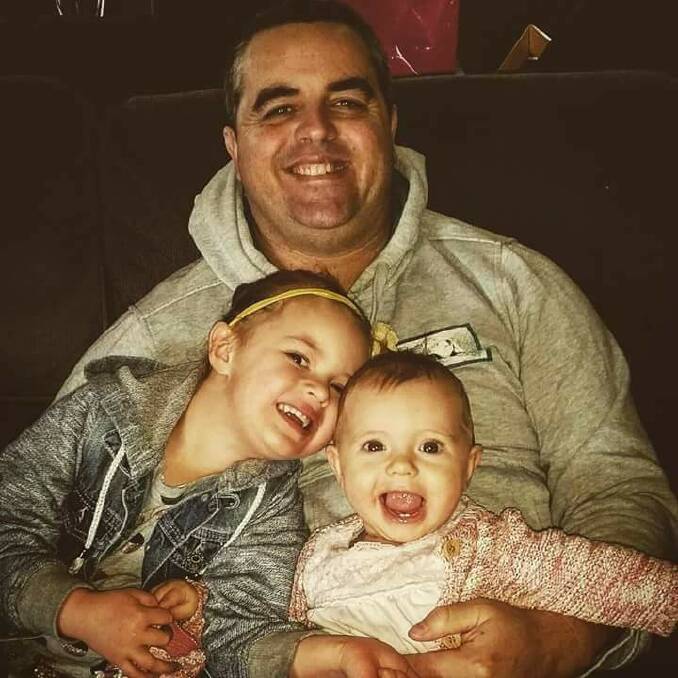 Nigel Munro with his daughters Sienna and Tia. 