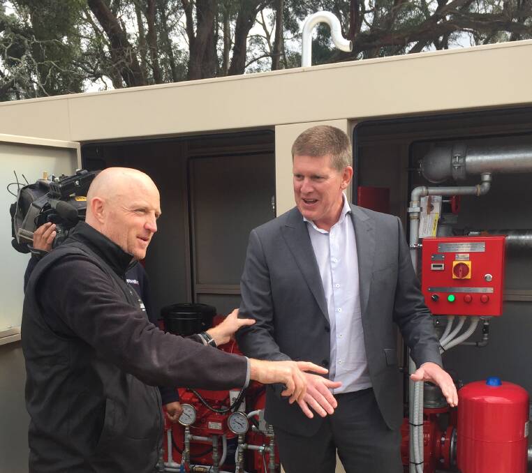 FIRE READY: Craig Jenkins of S.J. Weir showing ESTA acting CEO, Ben Piper the new pump system.