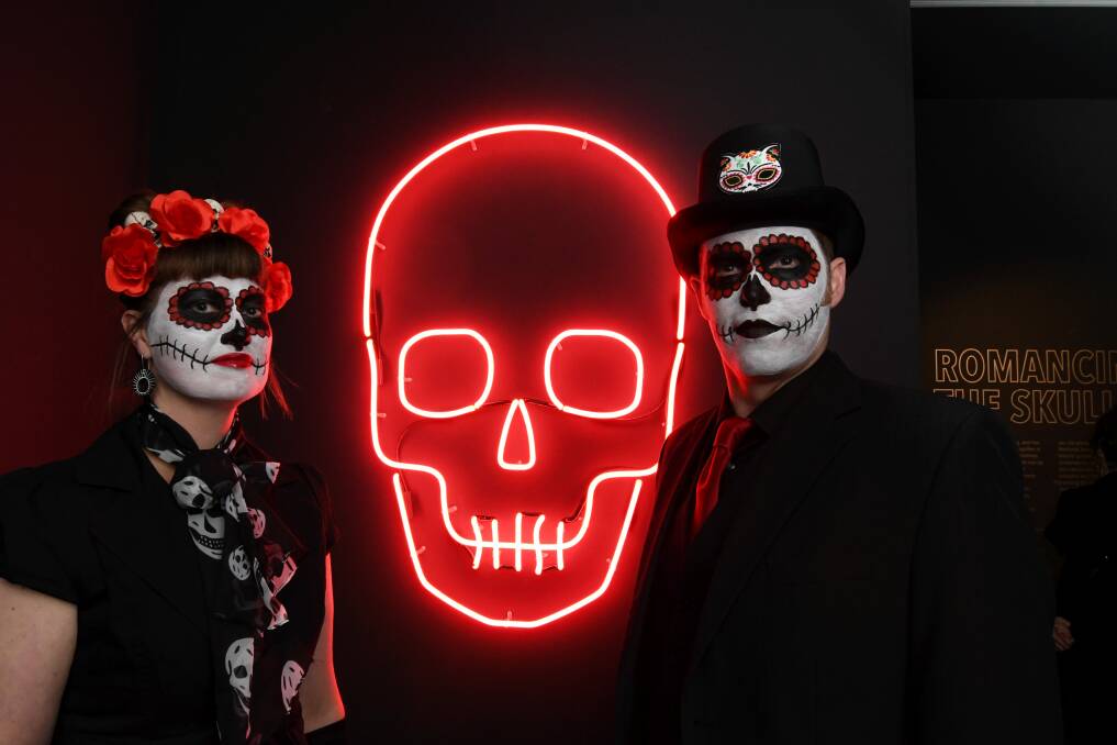 CRÁNEO: Clare Blake and Duncan Lannan draw inspiration from the day of the dead at the opening night of the Romancing the Skull exhibition. Picture: Lachlan Bence.